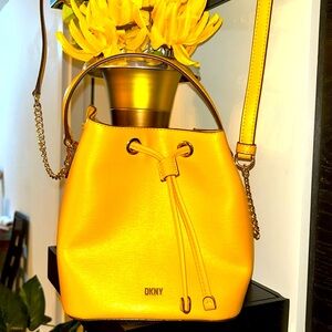 Mustard color DKNY mini hand bag. Gently used (2x)send me an offer please!!
